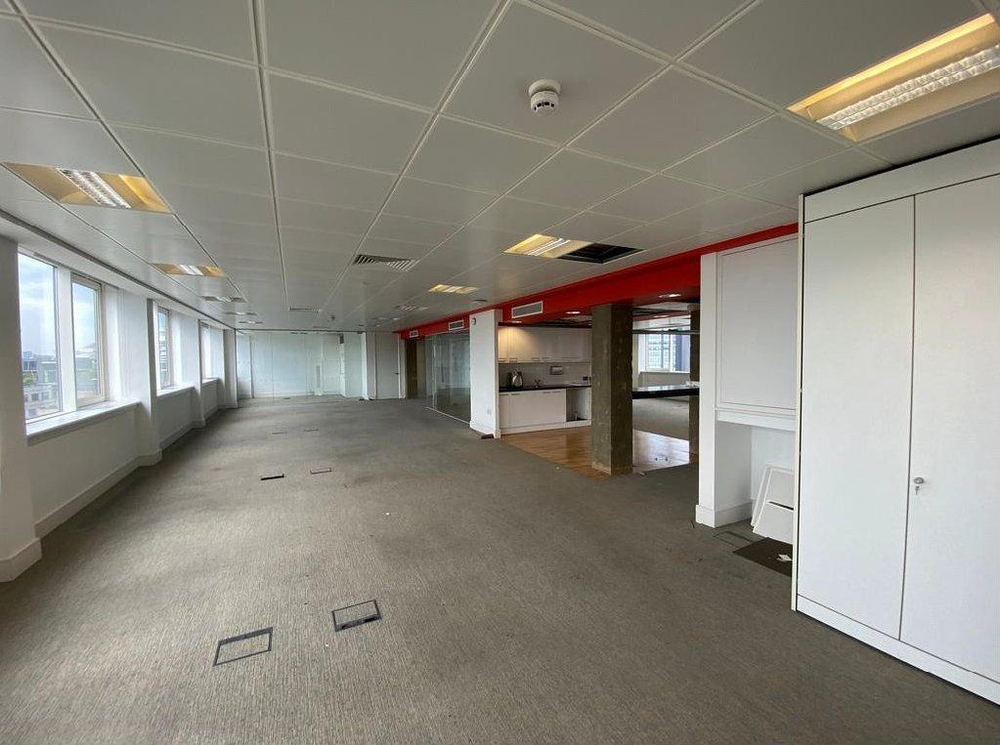 The interior of St Clare House — low dropped ceilings, dated finishes, and an inefficient office floorplate.